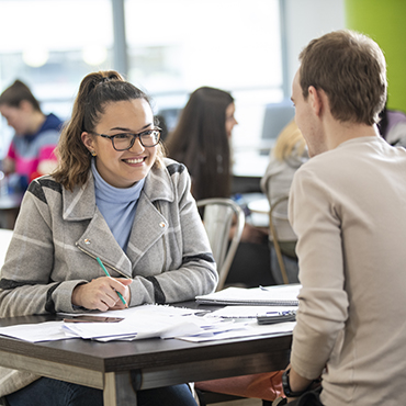 Two MSc in Management students talking in NCI canteen
