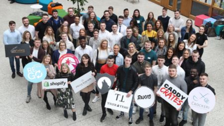 Group of NCI students posing for photo on NCI campus