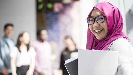 Student looking at camera smiling