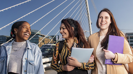 NCI Students walking across the Samuel Beckett Bridge in Dublin