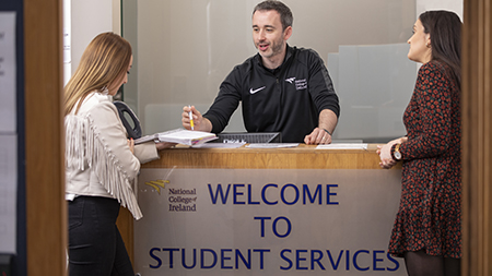 Staff member working at NCI Student Services office