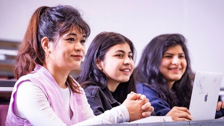 Three international NCI students in classroom