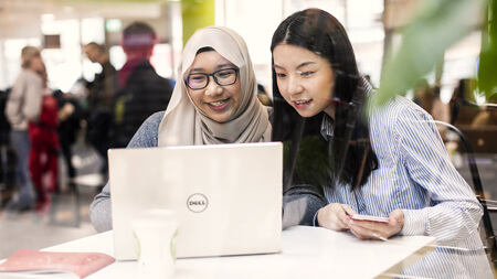 NCI students working on a laptop