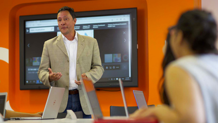 Lecturer talking to students in NCI Classroom