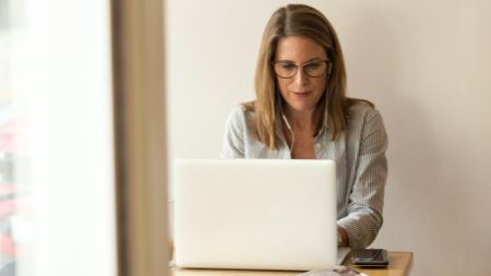 NCI Psychology student working on laptop