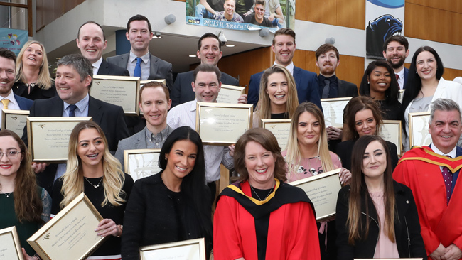 Group photo of recent NCI graduates