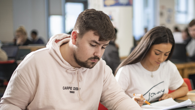 Two NCI students working in classroom