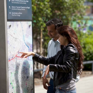 International Students looking at Sign