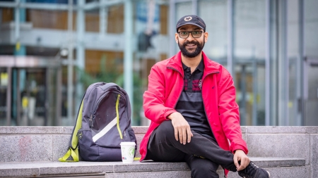 Image of Student with Backpack in front of NCI