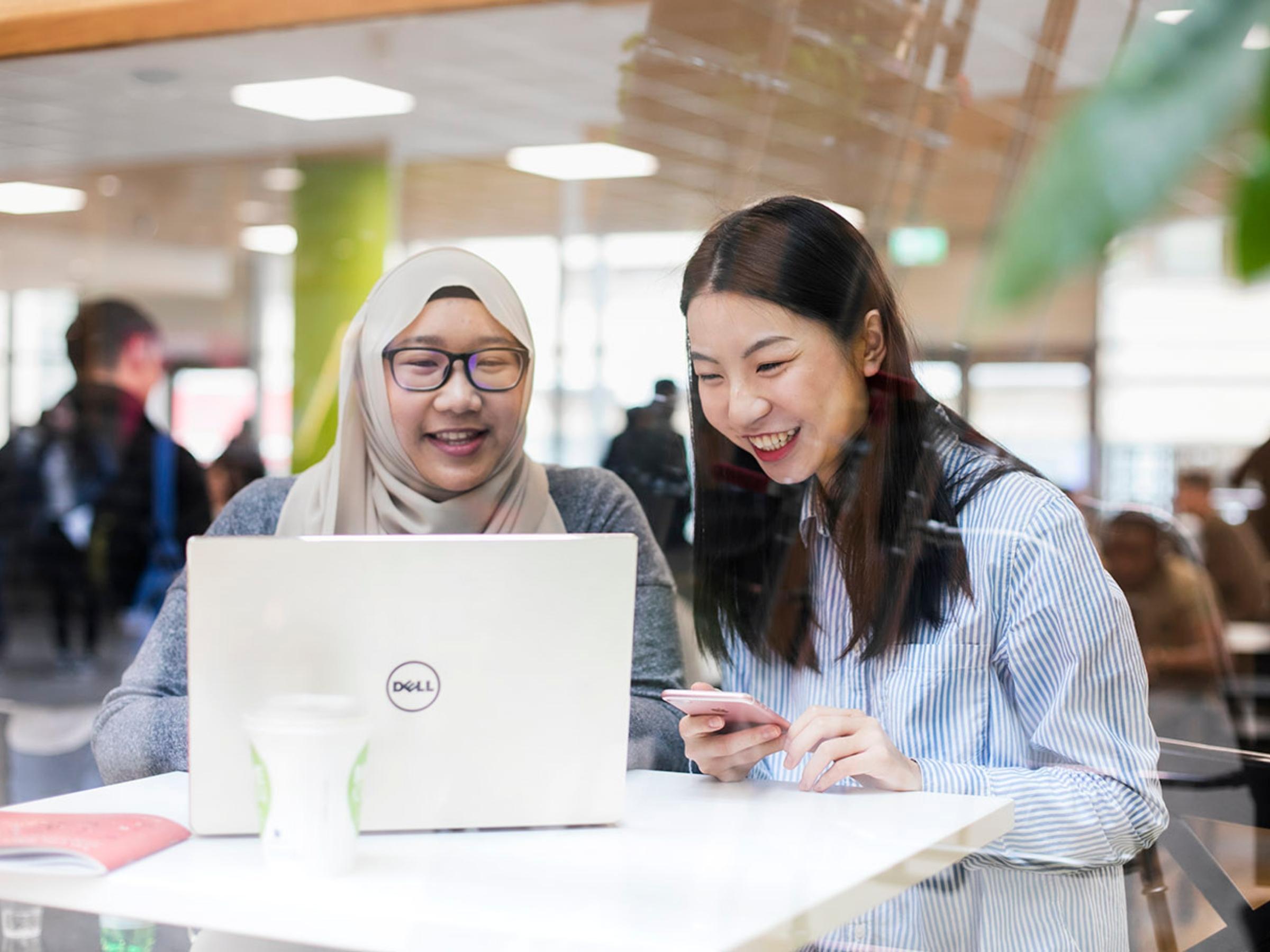 NCI students working together on a laptop 