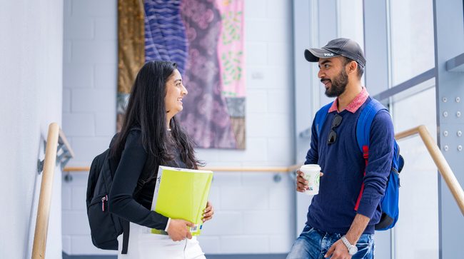 NCI students chatting on stairwell on NCI campus