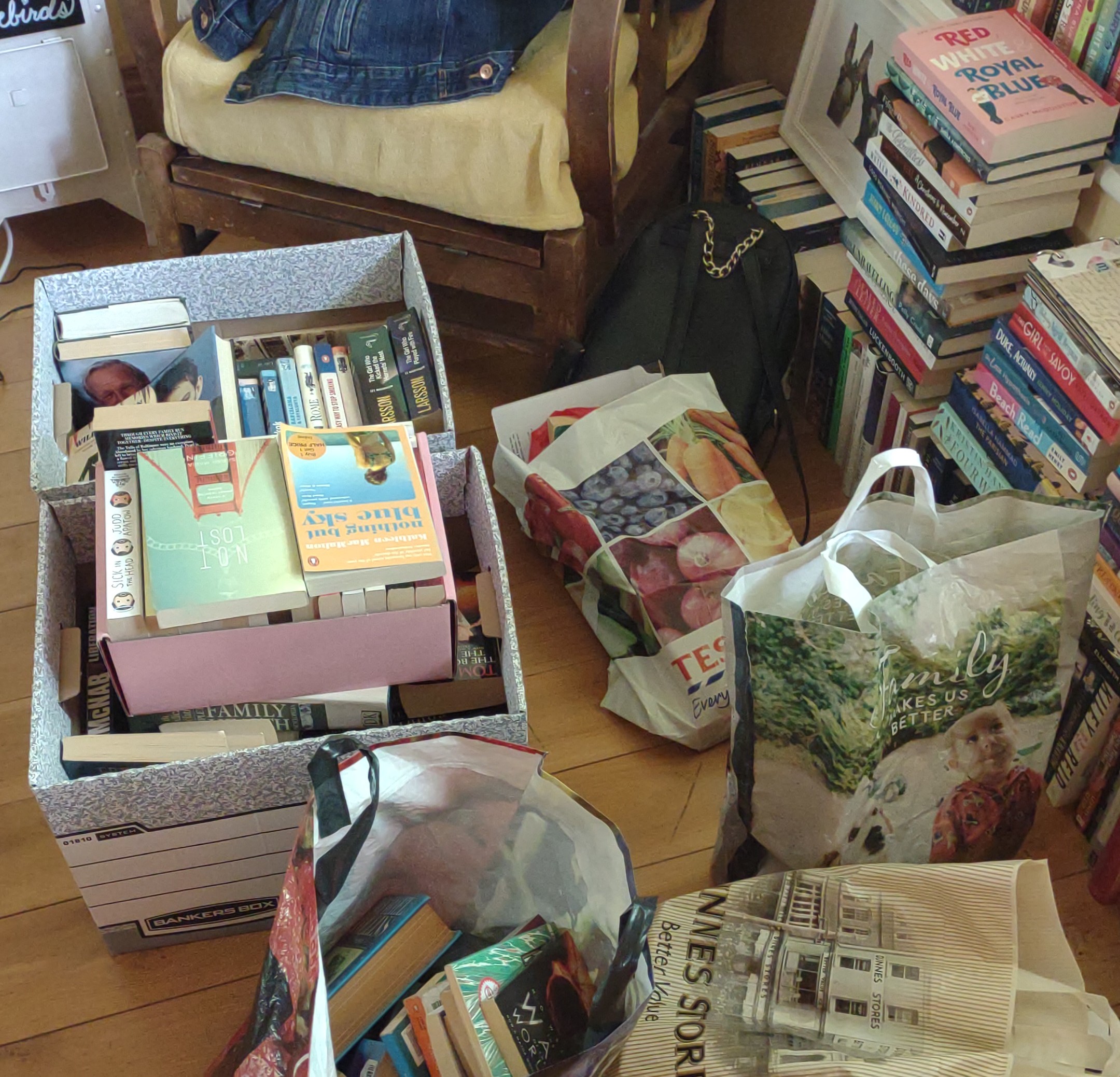 Lots of books in bags and boxes