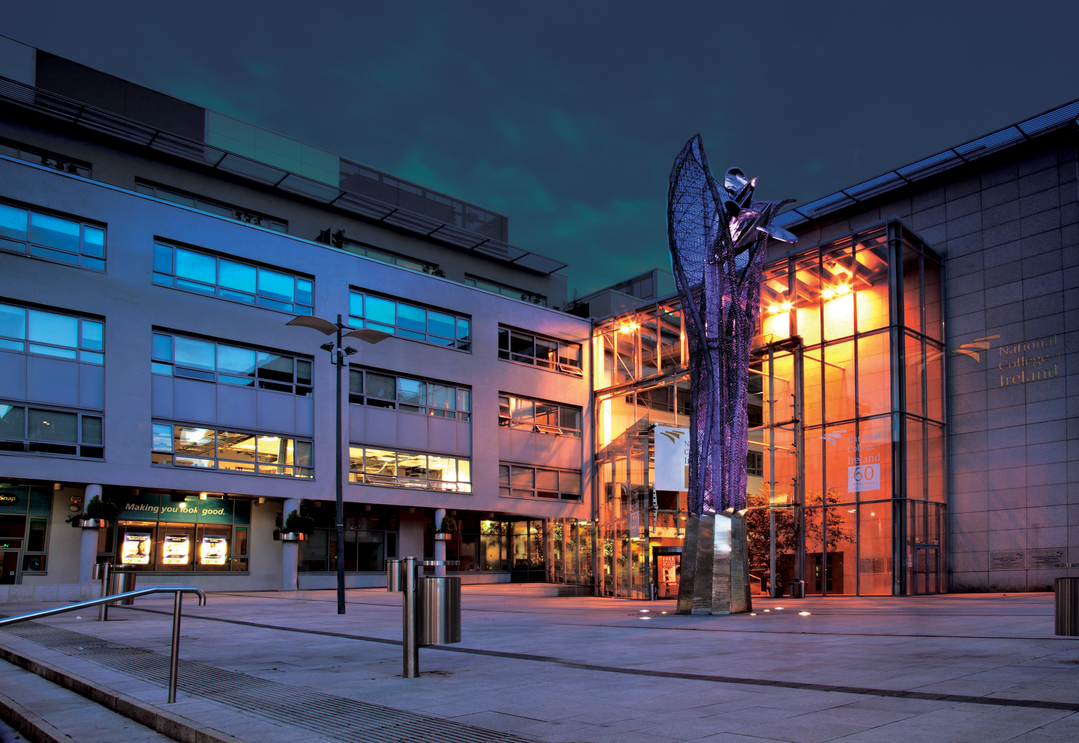 NCI Mayor Square view of front of building at night