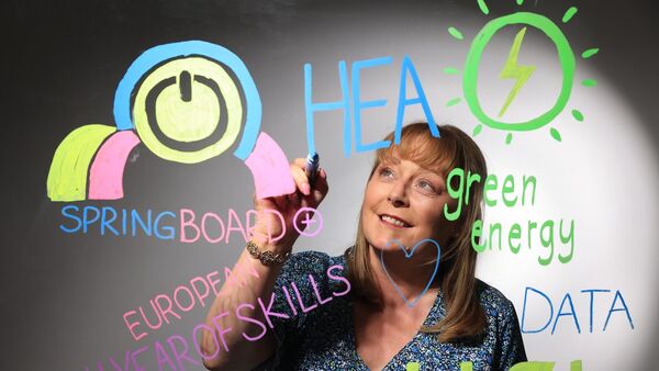 Illustration of a middle-aged woman exploring all the upskilling options provided by Springboard