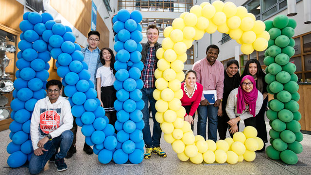 NCI international students with NCI balloons